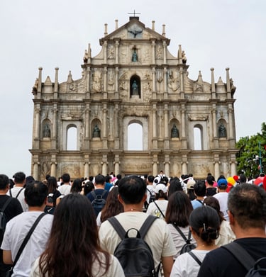 Iconic Zhuhai landmark illuminated at night with reflections on water.
