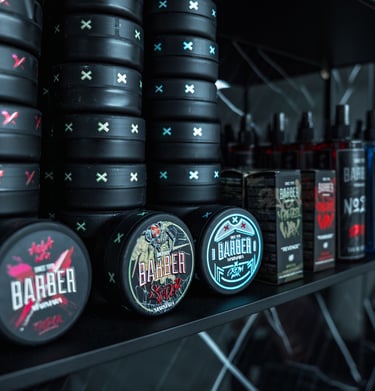 a shelf of barber products and other items