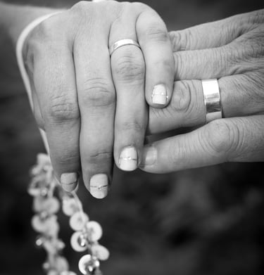 newly weds holding hands in black and white