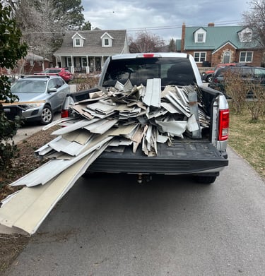 Aluminum siding loaded in truck bed for recycling 