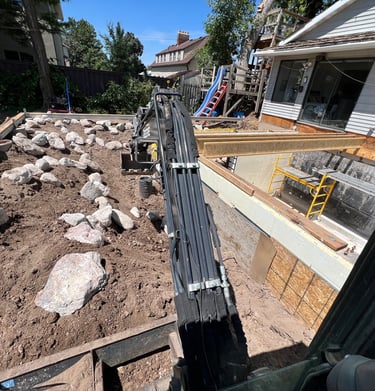 Excavator building a retaining wall