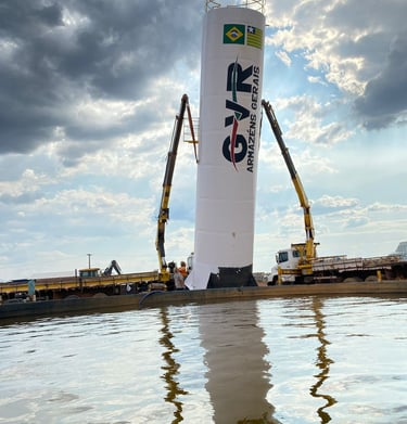 a crane is lifting a large white tower