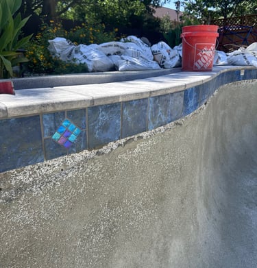New tile installed on a pool during a remodel