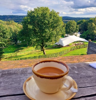 Enjoying coffee looking at the green rolling hills
