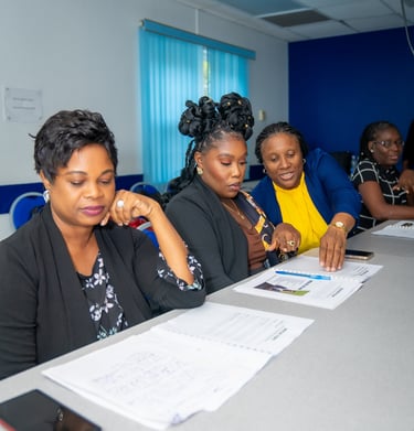 a group of people sitting at a table resolving a problem together