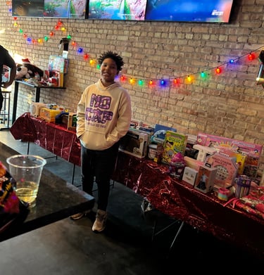 365 We Thrive NFP participant at the coat and toy drive assisting