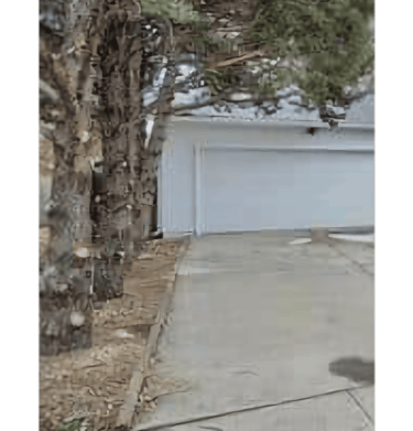 a fire hydrant sitting on the side of a driveway