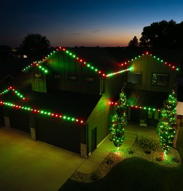 Red & Green Seasonal Lighting On Home and Trees