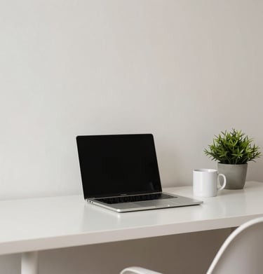 A minimalist workspace in a South American / Brazilian home office, featuring a laptop, a coffee mug, and a small green plant, crisp off-white and soft pale blue tones.