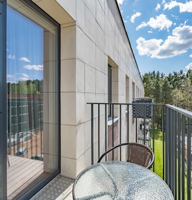a table with a table and chairs on a balcony