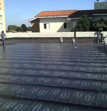 a man standing on a roof top with a lot of numbers on it