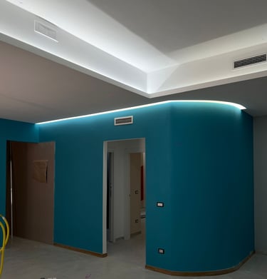 a room with a blue wall and a yellow chair