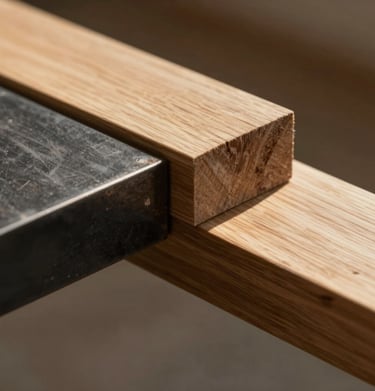 Close-up of high-quality architectural materials: charcoal steel beams meeting warm oak wood, beautifully lit by side sunlight.