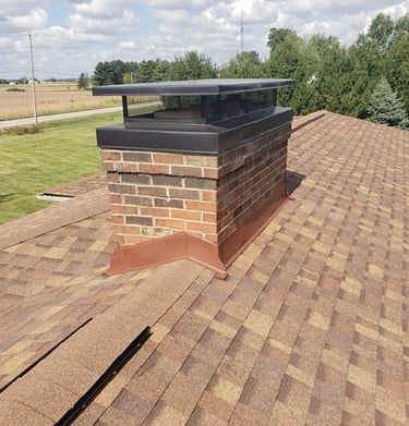 Brick chimney masonry project in Waltham, MA performed by NE Chimney professionals.