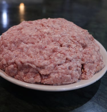 a plate of kheema with a large amount of meat