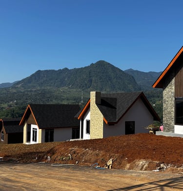 a house with a lot of windows and a mountain in the background