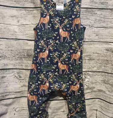 a baby's romper with a deer print