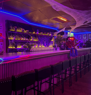 “Interior view of Kava Bar LA & Botanical Lounge, featuring a cozy atmosphere with comfortable seat.
