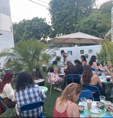 Guests enjoying a Sip & Paint event on the patio at Kava Bar LA & Botanical Lounge