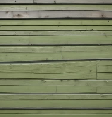 Close-up of siding with mold stains fading after soft washing treatment.