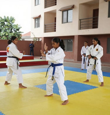 An instructor demonstrating self-defense moves to a small group in a bright studio.