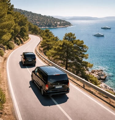 Two black Mercedes Vito minivans driving along the Athens Riviera coast with luxury yachts