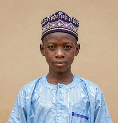 A sculptural piece made from reclaimed metal, reflecting light and shadow in dynamic patterns.