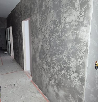 Rustic wood-look porcelain tile flooring installation with textured grain patterns in a modern home.