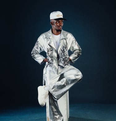 Amapiano Odi Dance and Beginner teacher Flex of TheOne Studios in Nairobi, in a shiny outfit