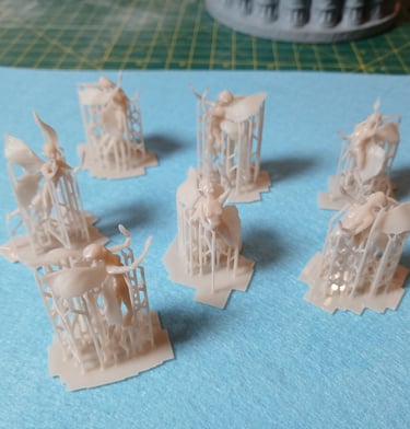 Fine detail resin fairy figures 3D printed with support structures as part of custom 3D sculptural services