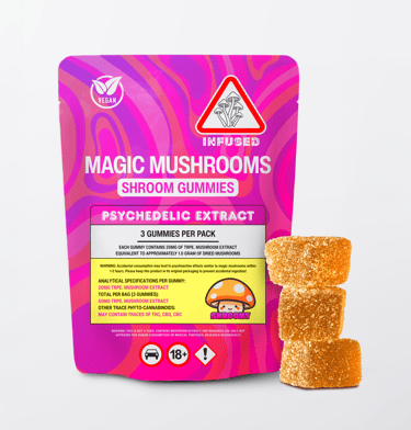 A pink package of vegan infused magic mushroom gummies next to three sugar-coated psychedelic mushroom edibles.
