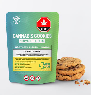 A stack of chocolate chip cannabis cookies next to a green and blue 100mg THC edible package.