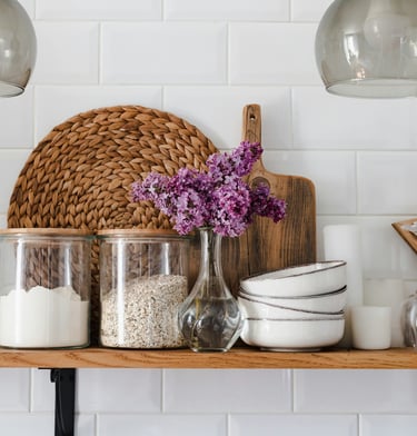 Calm, organized home interior with decluttered shelves and styled accessories