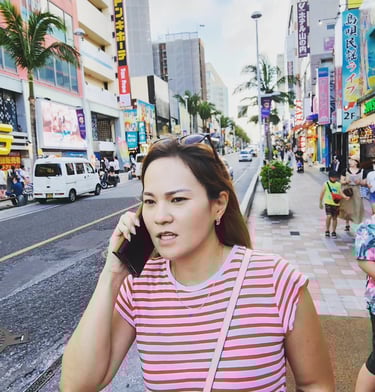 a Japanese woman talking on her cell phone