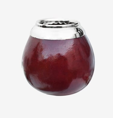 Polished dark red yerba mate gourd cup with a silver metal rim on a white background.