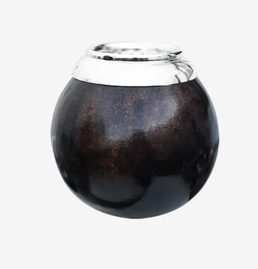 Traditional dark leather yerba mate gourd with a polished silver rim for drinking tea.