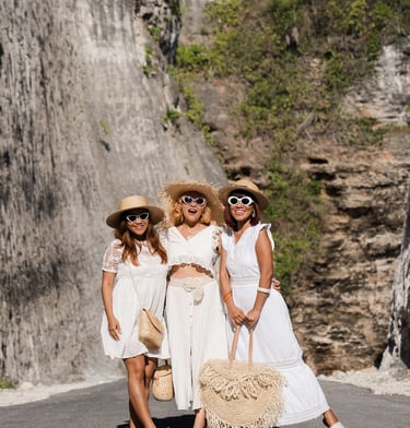 Group portrait of friends during private celebration photoshoot at Melasti Beach Bali