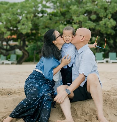 Mother sharing a tender moment with her son during a family session at Nusa Dua Beach Bali