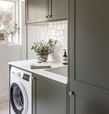 Custom built laundry cabinets by Silva Cabinetry