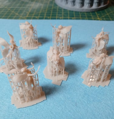 Fine detail resin fairy figures 3D printed with support structures as part of custom 3D sculptural services