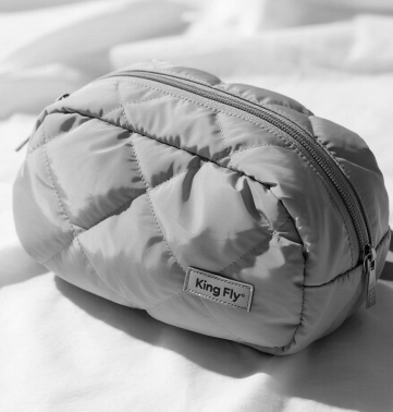 A stylish custom-made cosmetic bag showcasing King Fly's craftsmanship.