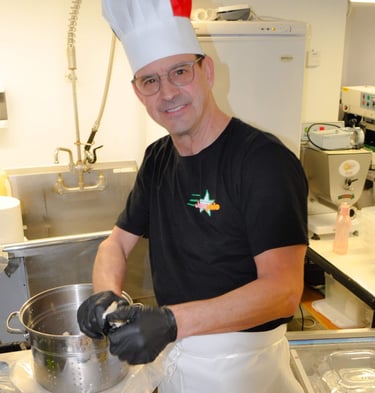a man in a chef hat and chef's hat
