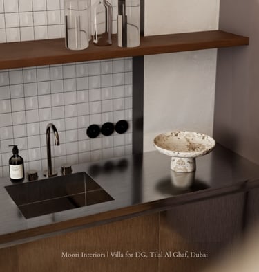 Modern sink area with a stainless steel countertop, white tiled backsplash, and a decorative bowl.
