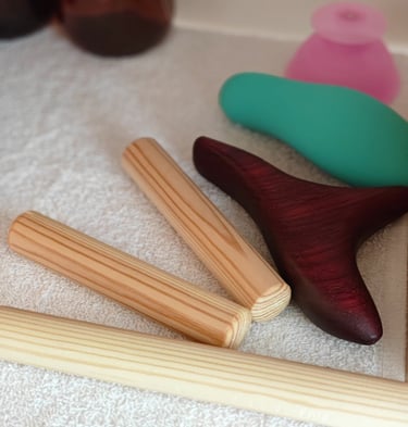 a variety of wooden massage tools on shelf