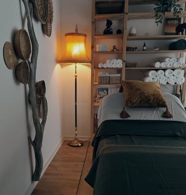 massagebed with golden pillow on top of a bed