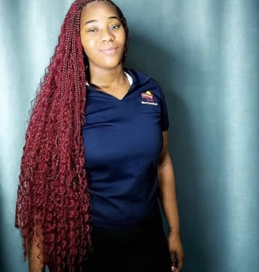 a woman with long red boho braids hairstyle