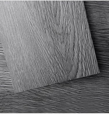 Modern kitchen flooring in deep gray vinyl planks — peel-and-stick, wood-look, durable surface.