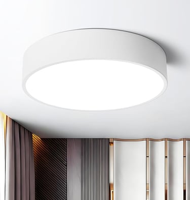  Minimalist white wall-mounted light fixture for soft bedroom illumination.