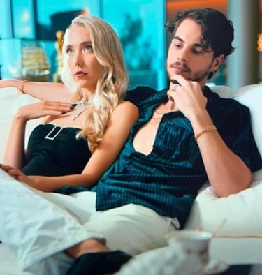 a man and woman sitting on a couch