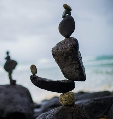 a stack of rocks sitting on top of a pile of rocks